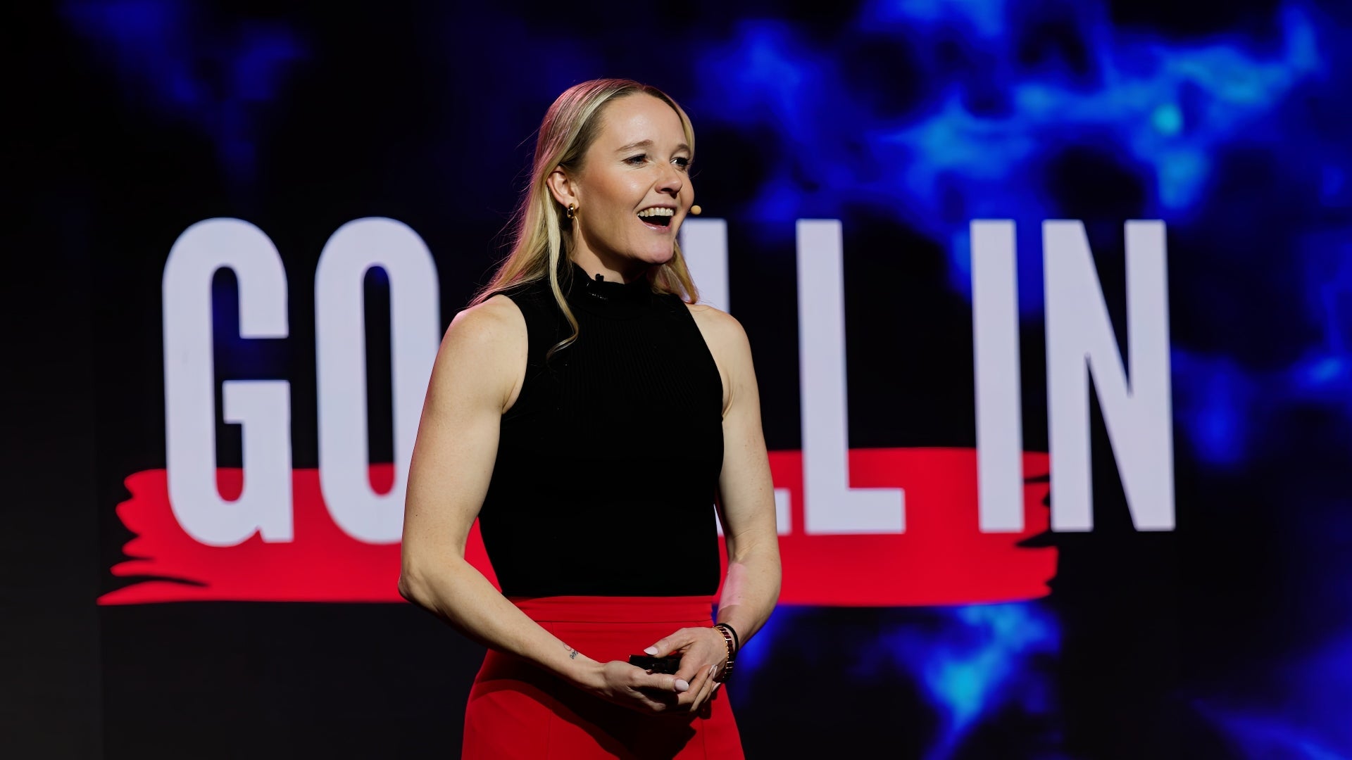 Sarah Wells speaking at a summit