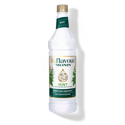 Monin Mint syrup bottle on a white background