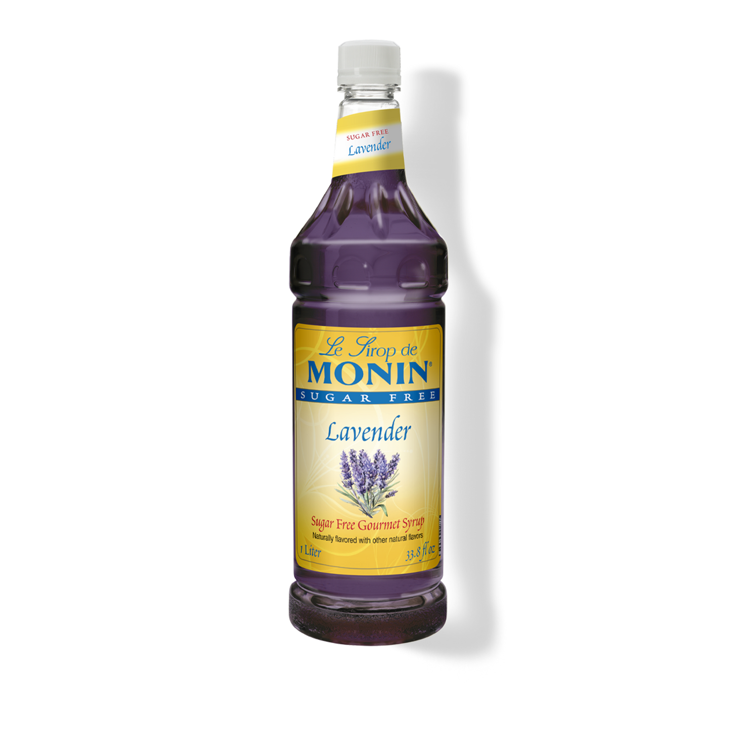 A bottle of Monin Lavender sugar-free syrup on a white background with a soft shadow. The bottle is filled with deep purple liquid and features a yellow and blue label with lavender illustrations.