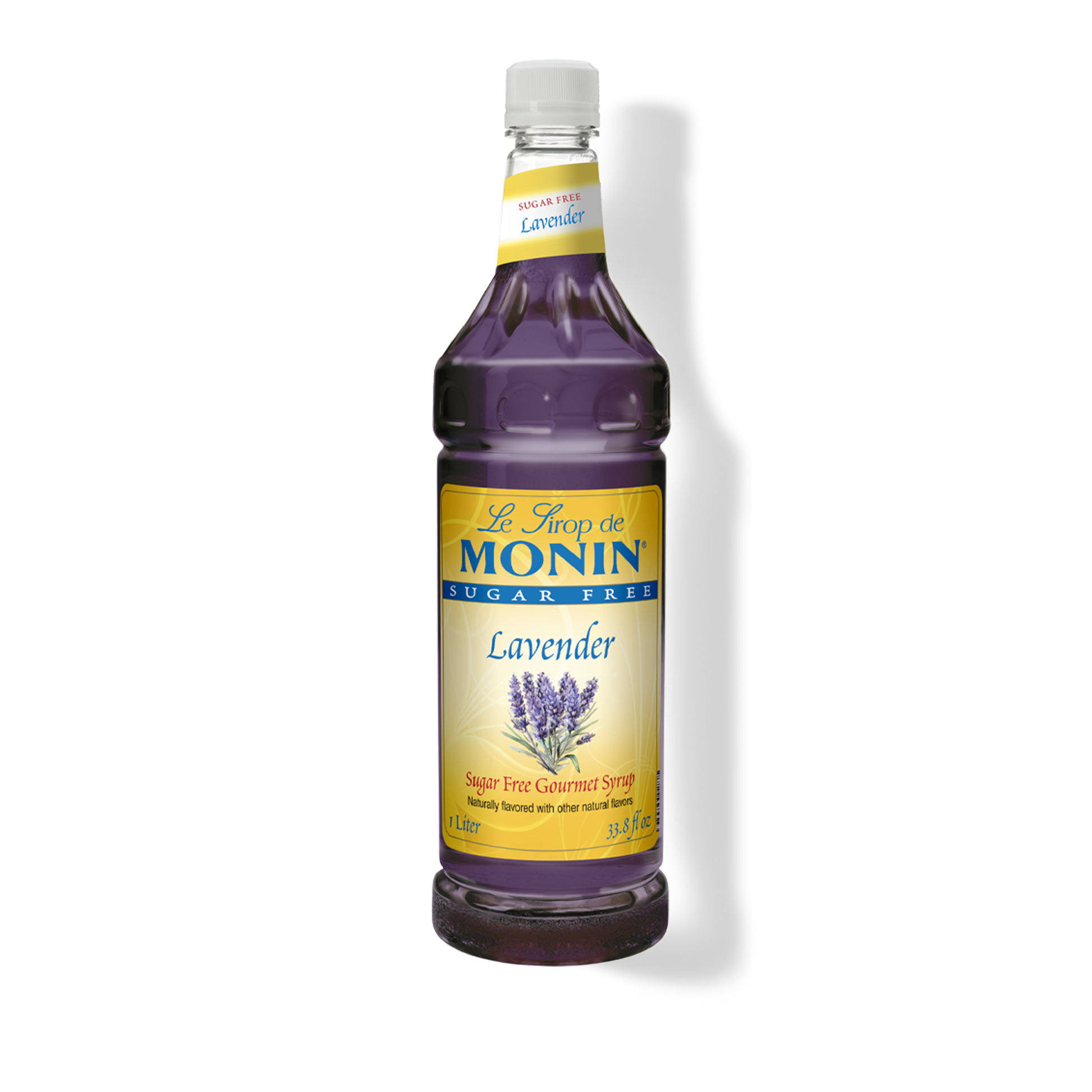 A bottle of Monin Lavender sugar-free syrup on a white background with a soft shadow. The bottle is filled with deep purple liquid and features a yellow and blue label with lavender illustrations.