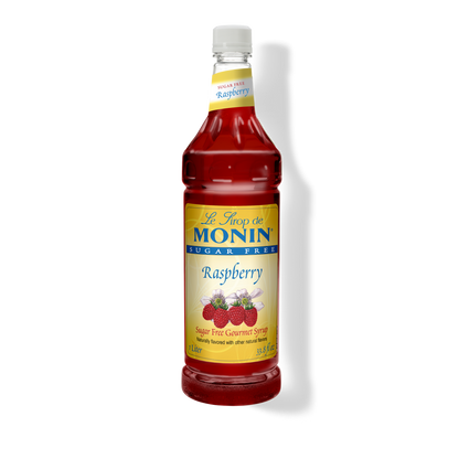 A bottle of Monin Le Snuf de Raspberry Sugar Free Gourmet Syrup on a white background with a soft shadow.
