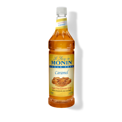 A bottle of Le Sirop de Monin Sugar Free Caramel syrup, 114 fl oz, shown on a white background with a soft shadow.