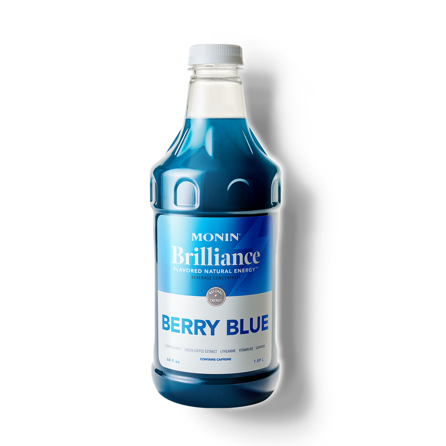 Monin Berry Blue syrup bottle on a white background