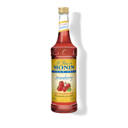 A bottle of Monin Sugar Free Strawberry syrup on a white background with a soft shadow.