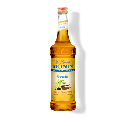 A bottle of Monin Sugar Free Vanilla syrup on a white background with a soft shadow.
