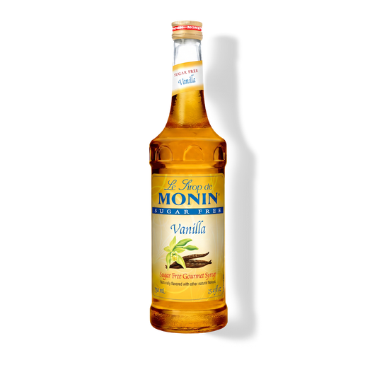 A bottle of Monin Sugar Free Vanilla syrup on a white background with a soft shadow.