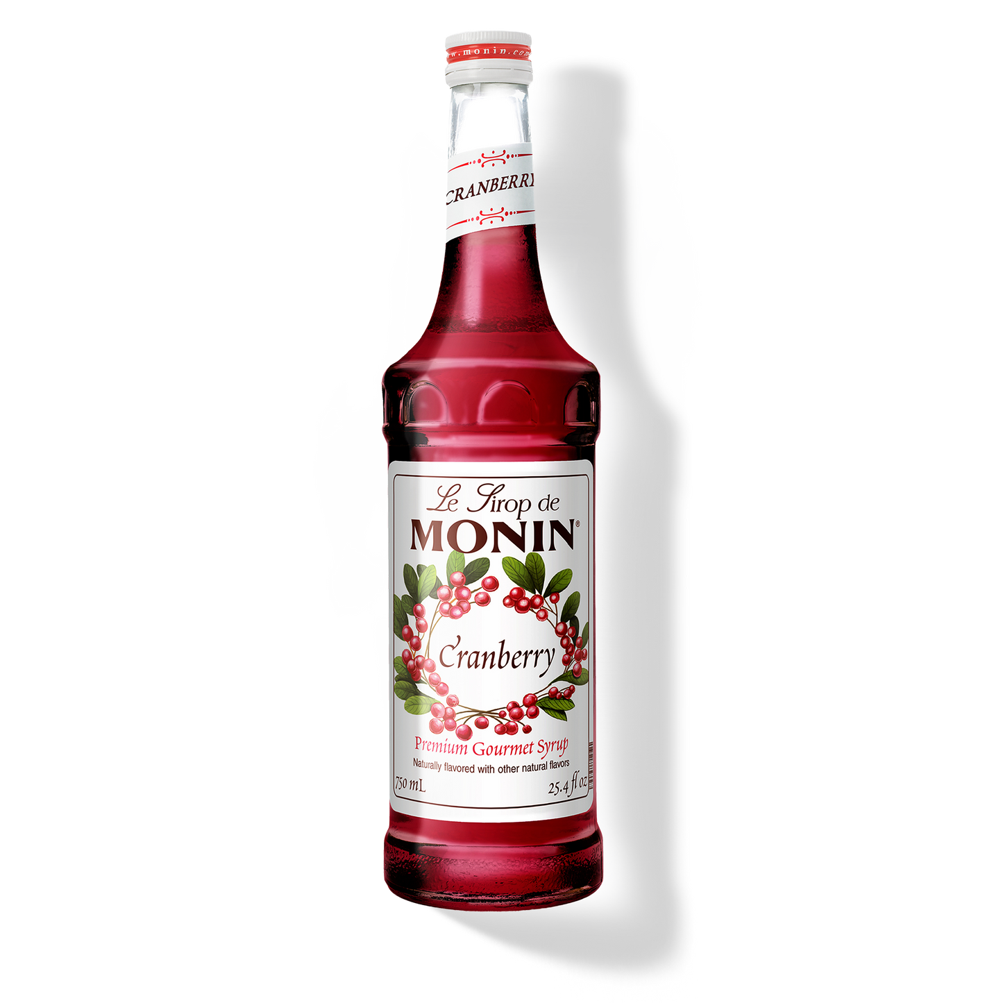 Monin Cranberry syrup bottle on a white background