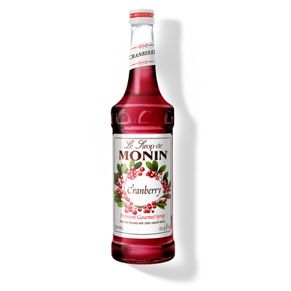 Monin Cranberry syrup bottle on a white background