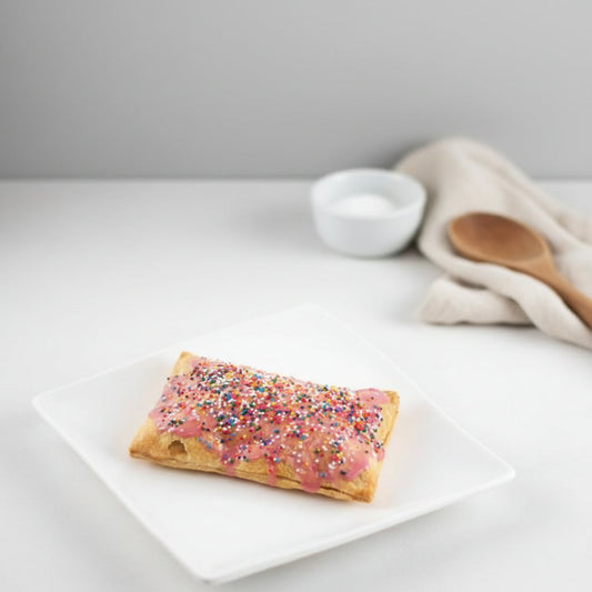 Cherry Pop-Tart made with Monin Tart Cherry Syrup and Monin Black Cherry Fruit Purée on a white plate. 