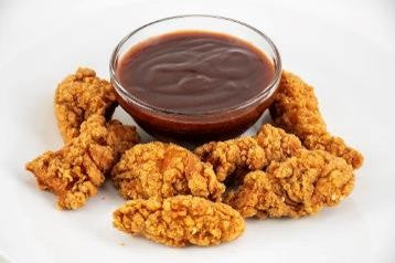 Fried chicken pieces with a side of Barbecue sauce
