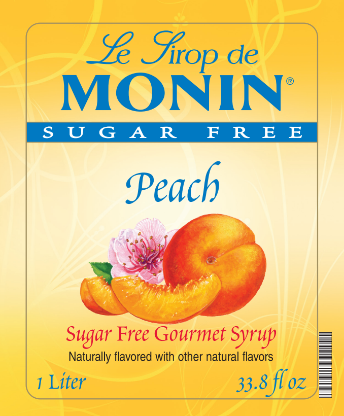 Front of a Le Sirop de Monin Sugar Free Peach syrup bottle label, showing peach slices, a peach, a pink flower, and text indicating 1 Liter / 33.8 fl oz.