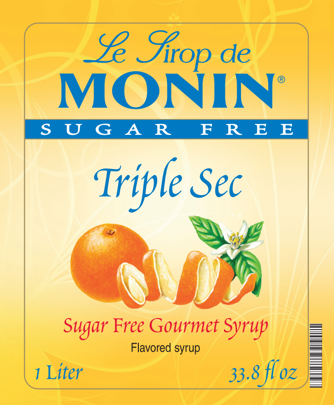 Front of a Le Sirop de Monin Triple Sec sugar free gourmet syrup package, showing orange fruit graphics and text on a yellow background.