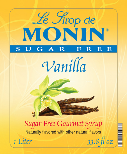 Front of a Le Sirop de MONIN Sugar Free Vanilla syrup carton, showing a yellow label with blue branding, vanilla flower and bean illustration, and text indicating 1 Liter / 33.8 fl oz.