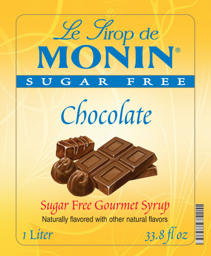 Front of a Le Sirop de Monin Sugar Free Chocolate syrup bottle label, showing chocolate pieces, the brand name in large blue letters, and flavor text on a yellow background.