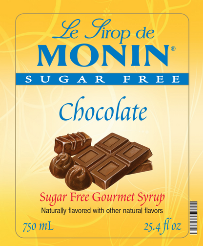 Front of a Le Sirop de Monin Sugar Free Chocolate syrup bottle label, showing a yellow background, blue brand text, and an illustration of chocolate pieces.