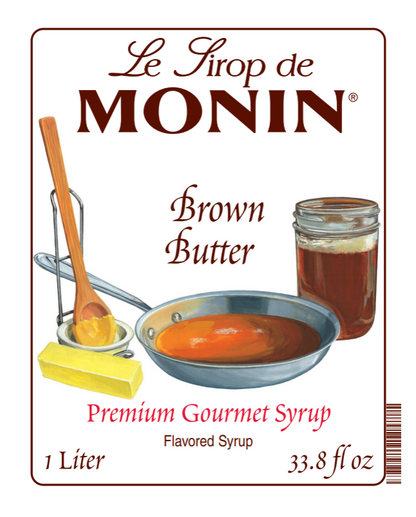 Front of a Le Sirop de Monin Brown Butter syrup bottle label, showing illustrated cooking props and a jar of amber syrup on a white background with brown border.