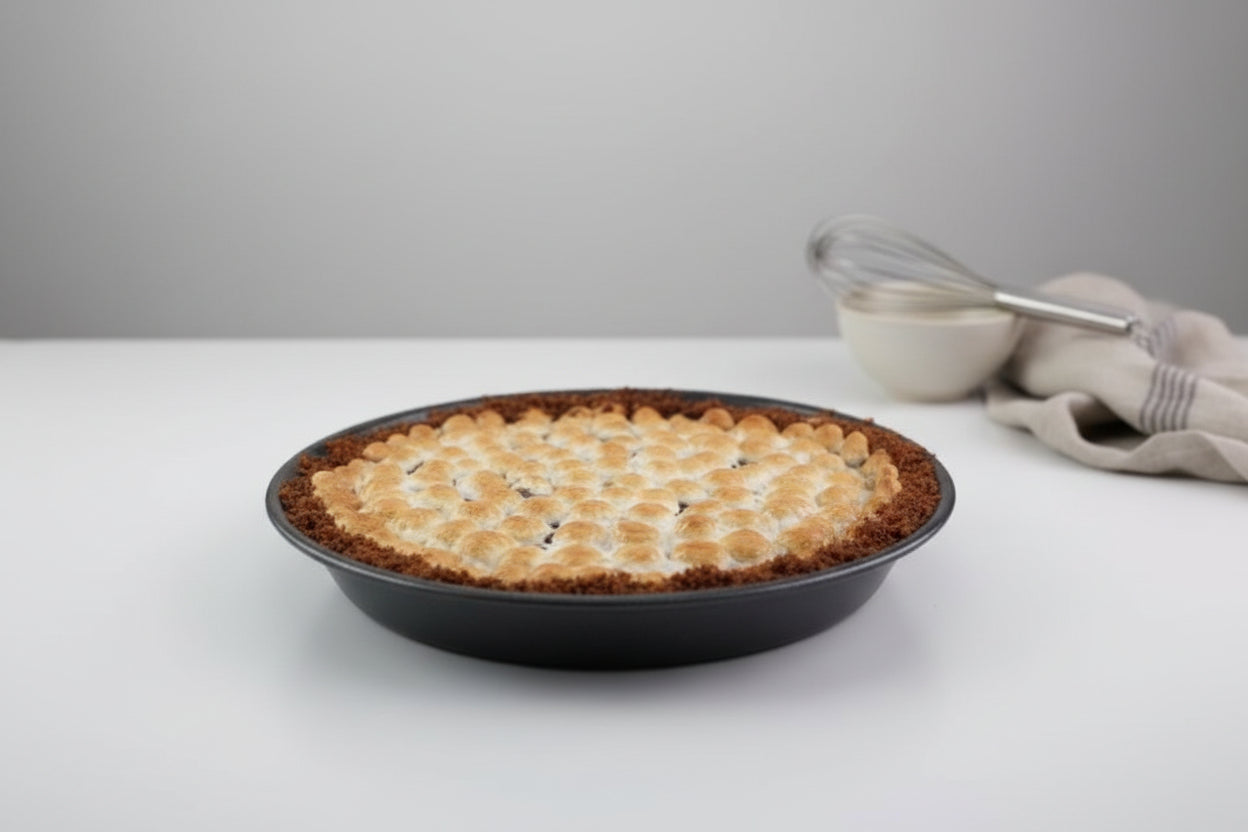 smore's pie in a pie dish on a white background